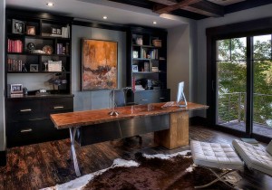 Dashing-home-office-in-gray-with-black-shelves-cabinets-and-a-live-edge-table