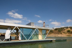 Floor-to-ceiling-glazing-surrounds-the-living-area-of-the-houseboat