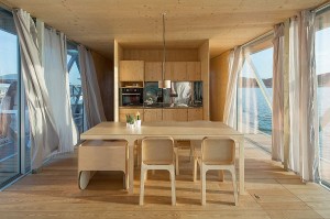 Open-plan-living-area-with-dining-space-and-kitchen-inside-the-uber-cool-floating-house