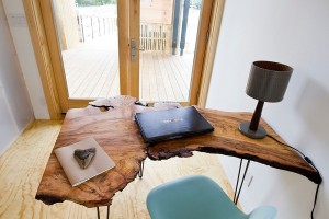 Small-home-office-design-with-a-stylish-live-edge-table-and-comfy-chair